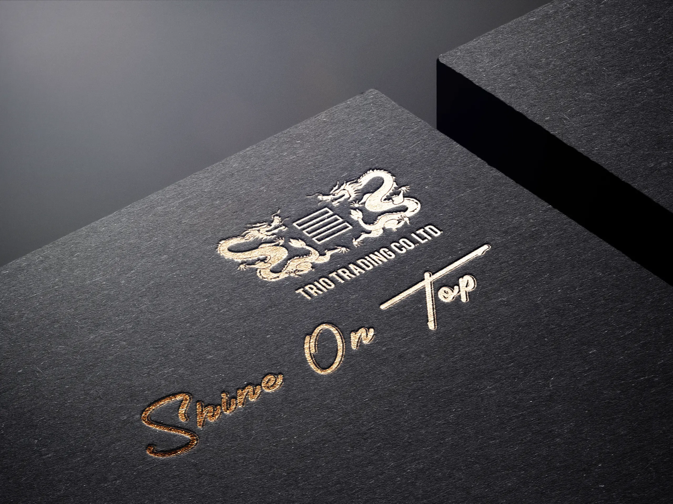 Trio Trading logo and "Shine On Top" foil-stamped on black card
