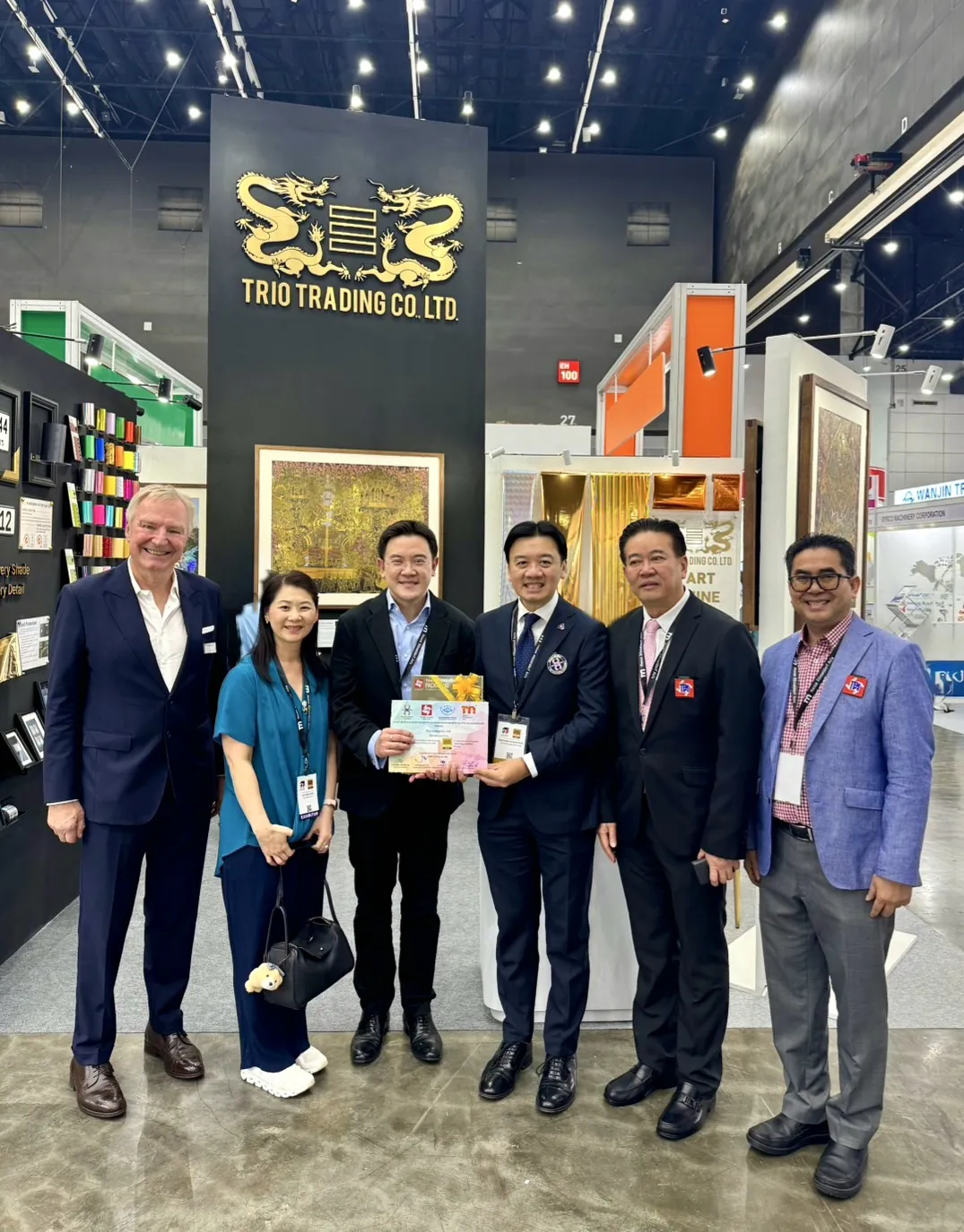 Guests gathered for a photo at Booth F27