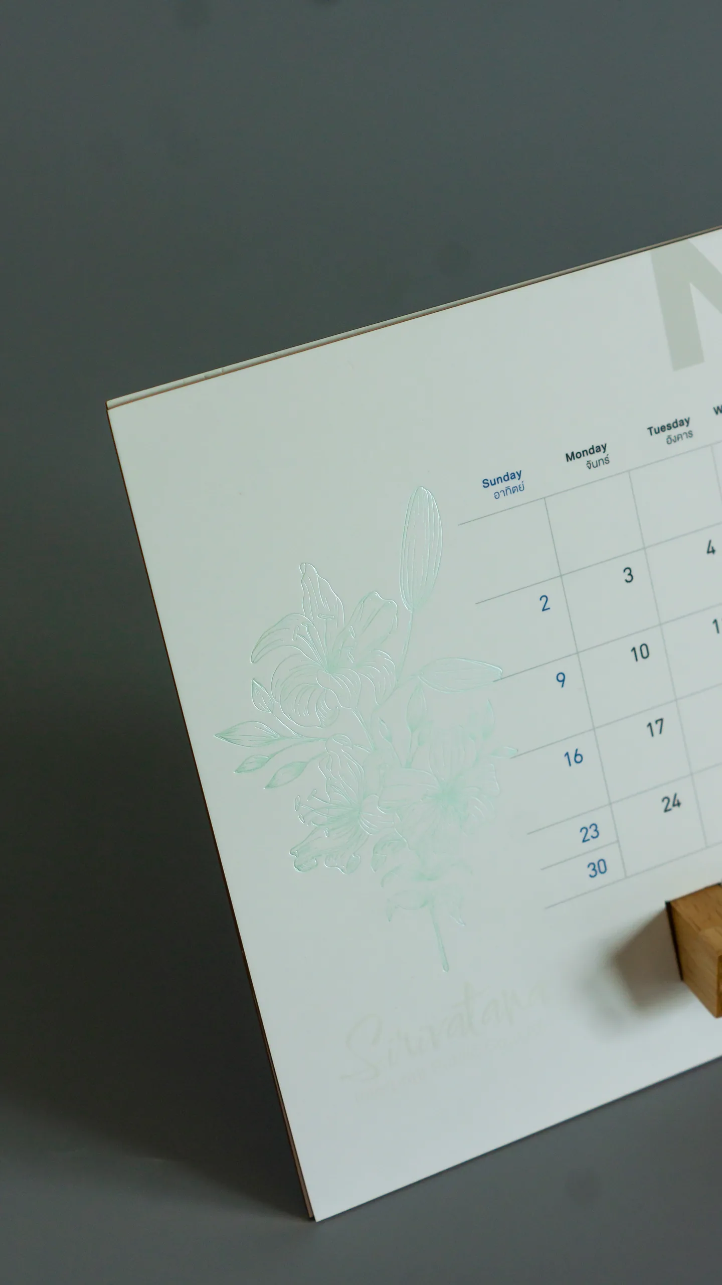 Mint pearl foil flowers on a desk calendar