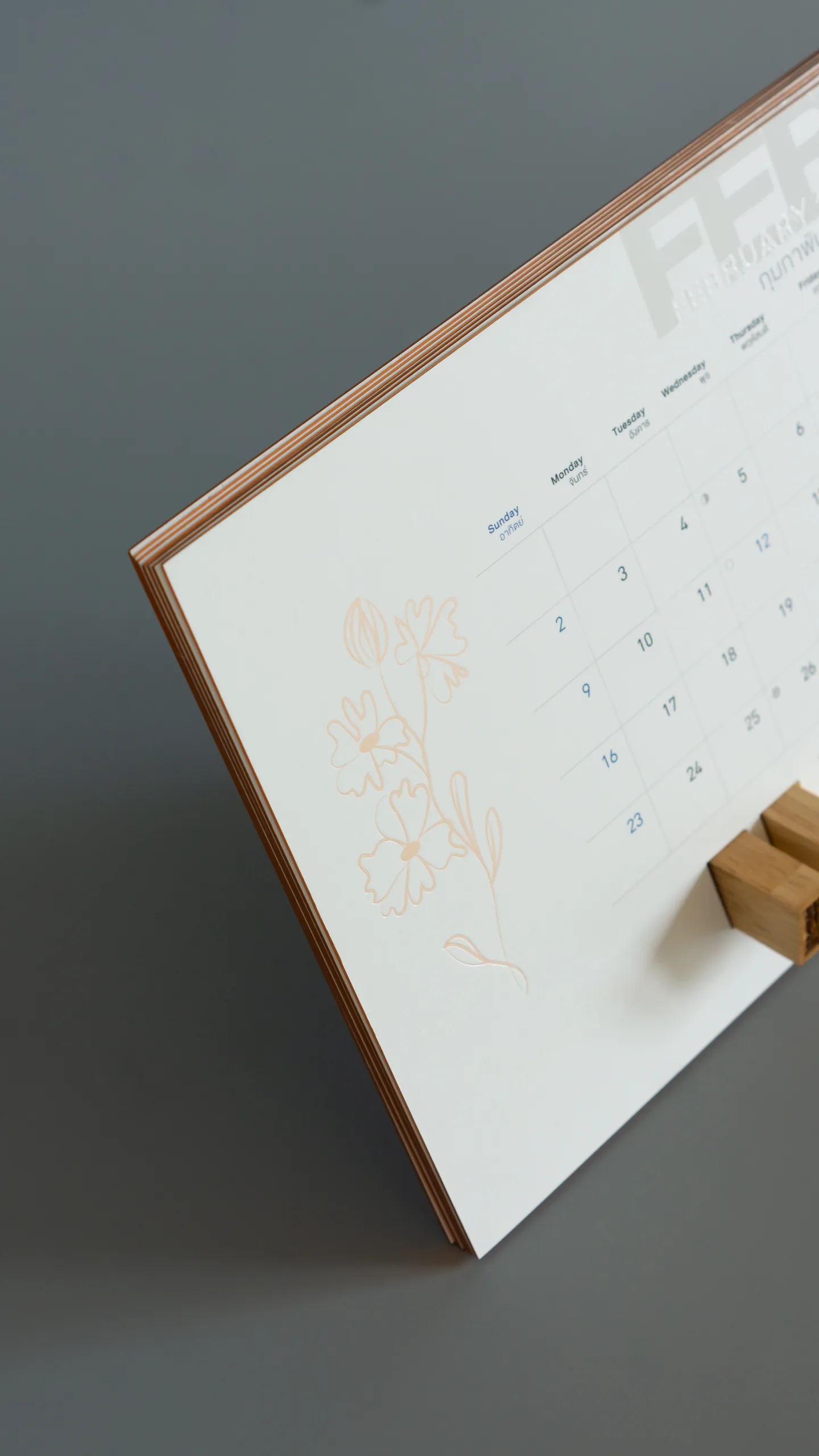 Peach pearl foil flowers on a desk calendar