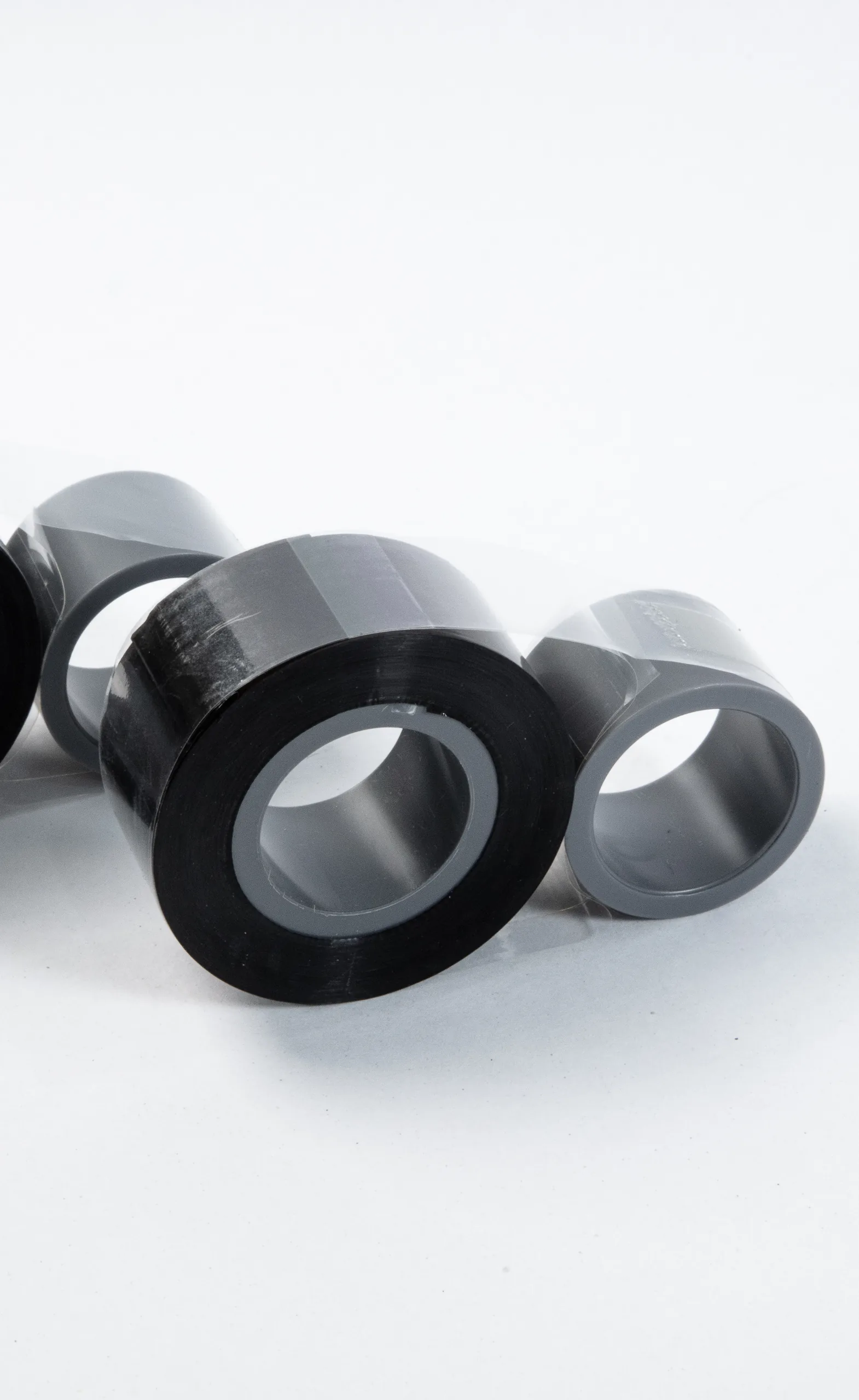 Black thermal transfer ribbon rolls on their cores